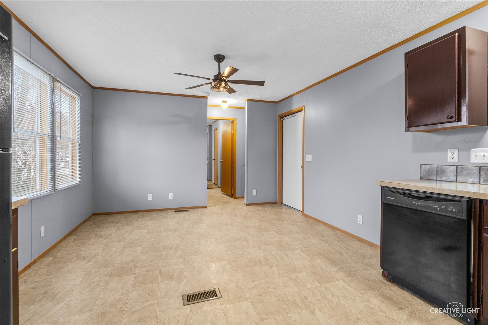 1101 Richard Road Elgin, IL 60123 - Photo 3 of 15 a view of an empty room with a fireplace and a window