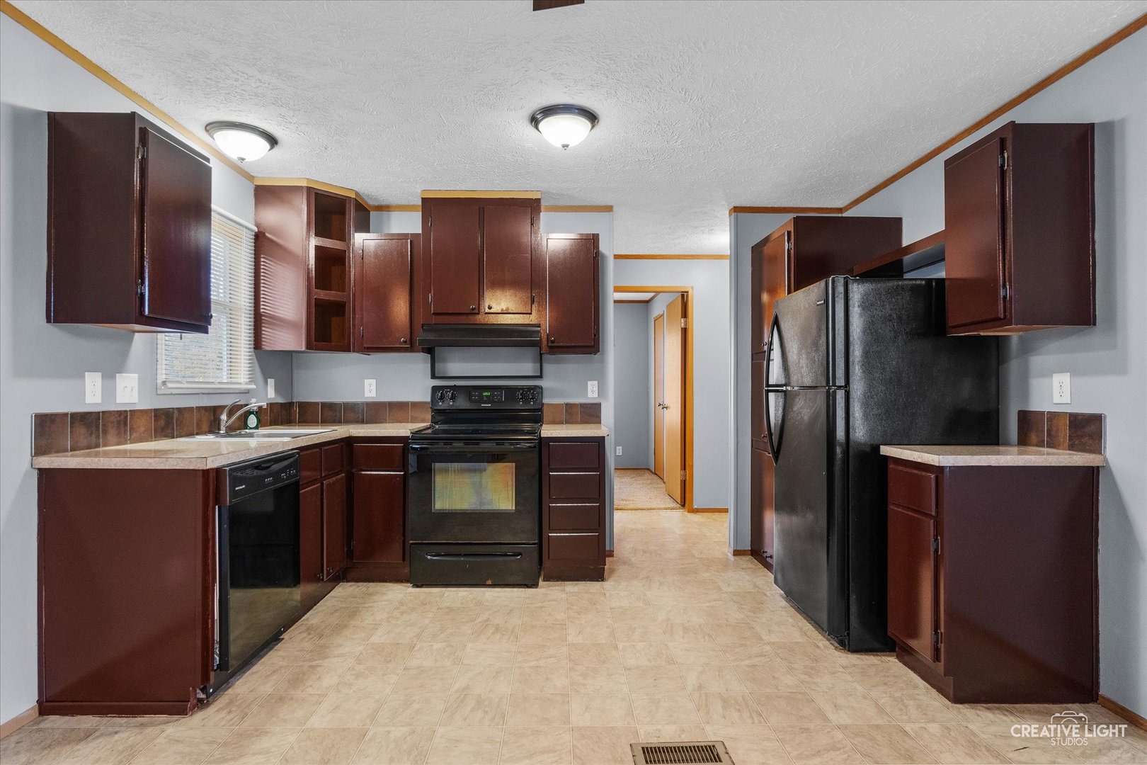 1101 Richard Road Elgin, IL 60123 - Photo 4 of 15 a kitchen with stainless steel appliances granite countertop a refrigerator and a stove