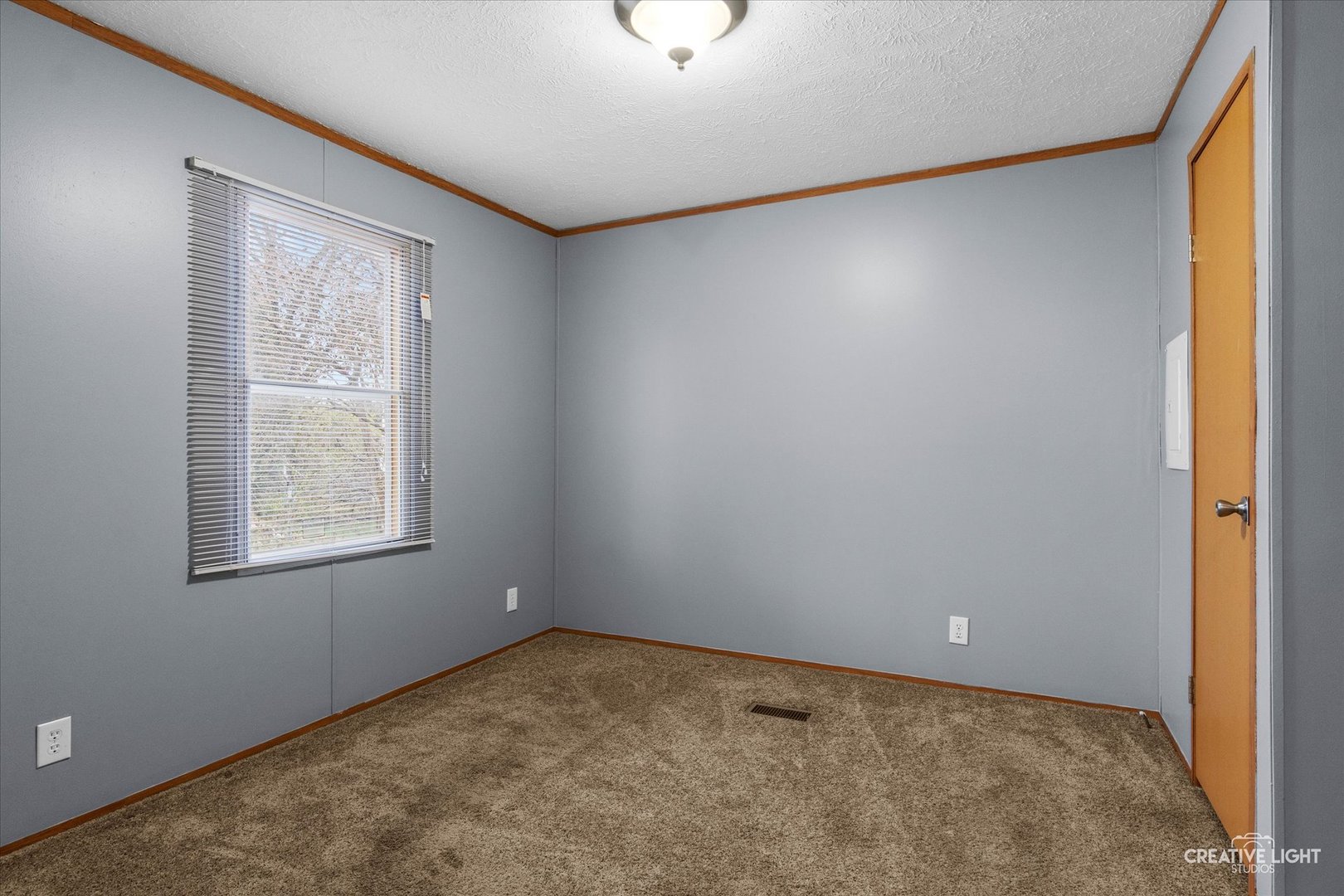 1101 Richard Road Elgin, IL 60123 - Photo 6 of 15 an empty room with windows