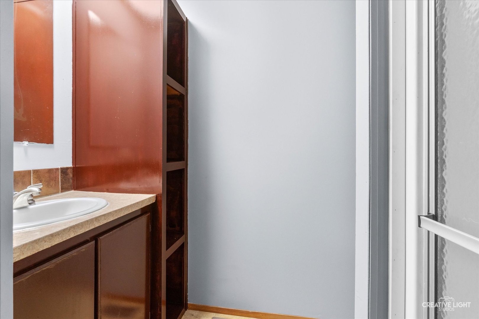 1101 Richard Road Elgin, IL 60123 - Photo 8 of 15 a bathroom with a sink and a mirror