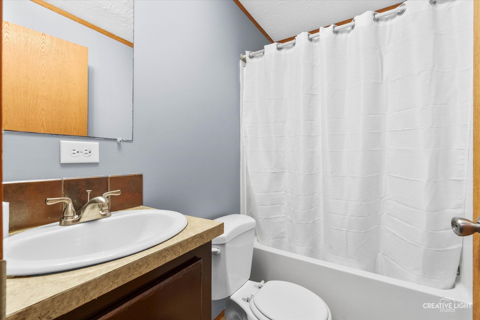 1101 Richard Road Elgin, IL 60123 - Photo 9 of 15 a bathroom with a sink toilet and shower
