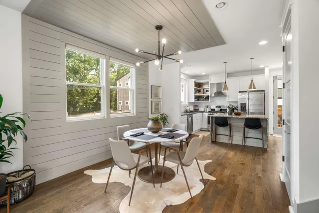 a dining room with furniture and window
