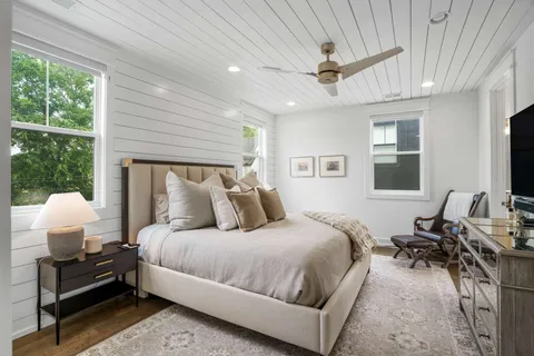 a bedroom with bed window and couch