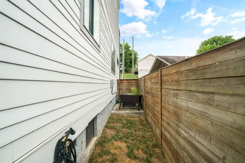 an aerial view of a house with backyard