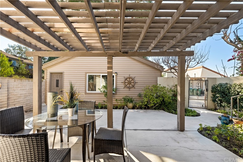 4625 Green Tree Lane Irvine, CA 92612 - Photo 12 of 51 a view of a patio with table and chairs and potted plants