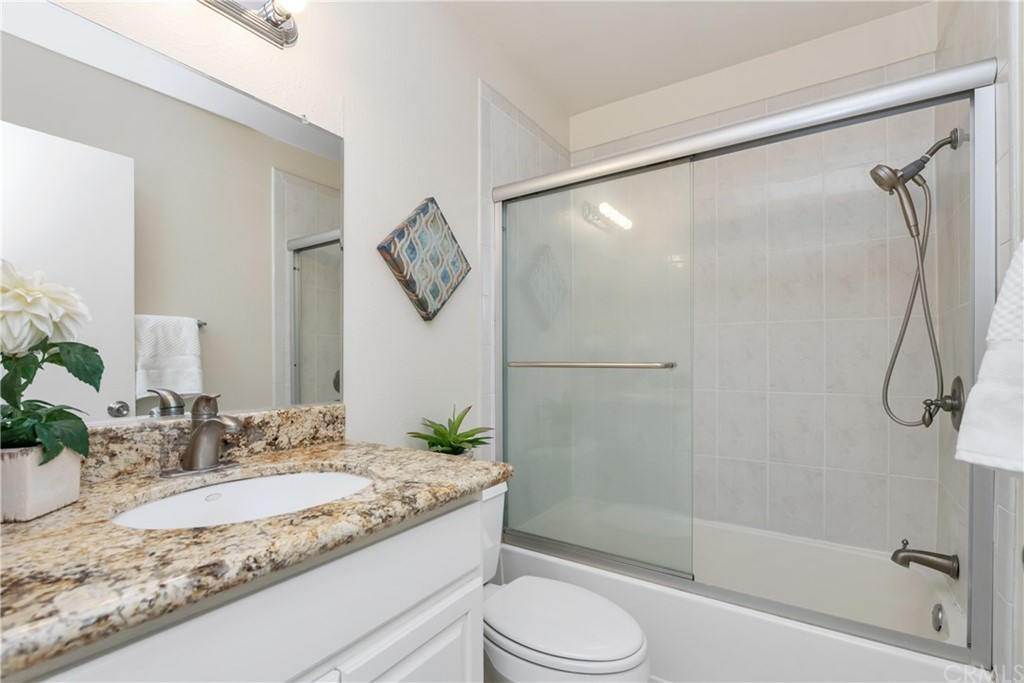 4625 Green Tree Lane Irvine, CA 92612 - Photo 28 of 51 a bathroom with a granite countertop sink toilet and shower