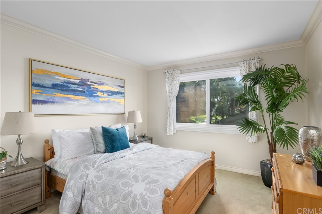 4625 Green Tree Lane Irvine, CA 92612 - Photo 30 of 51 a bedroom with a bed and a potted plant