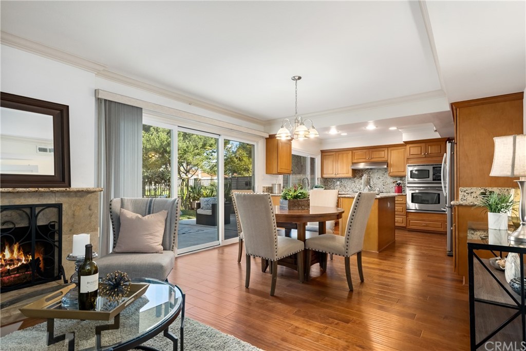 4625 Green Tree Lane Irvine, CA 92612 - Photo 3 of 51 a view of a dining room with furniture window and wooden floor