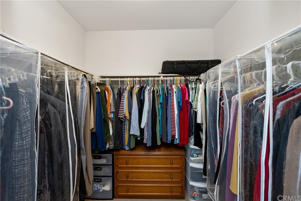 4625 Green Tree Lane Irvine, CA 92612 - Photo 31 of 51 a view of walk in closet with clothes