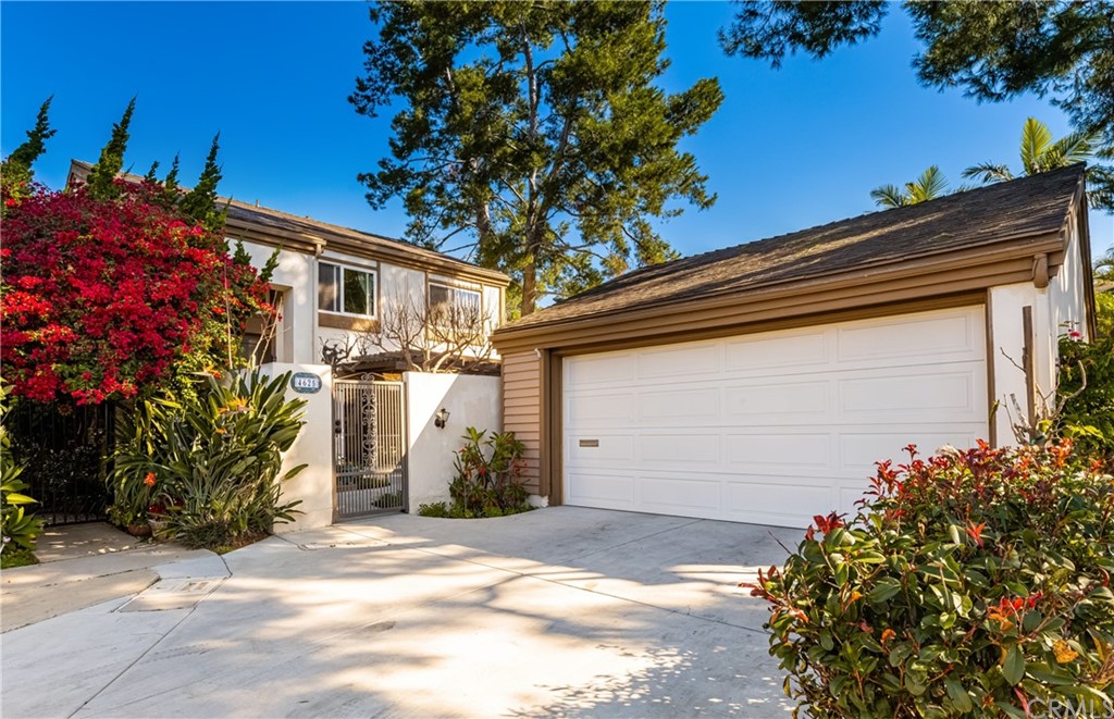 4625 Green Tree Lane Irvine, CA 92612 - Photo 39 of 51 a view of a house with a yard and garage