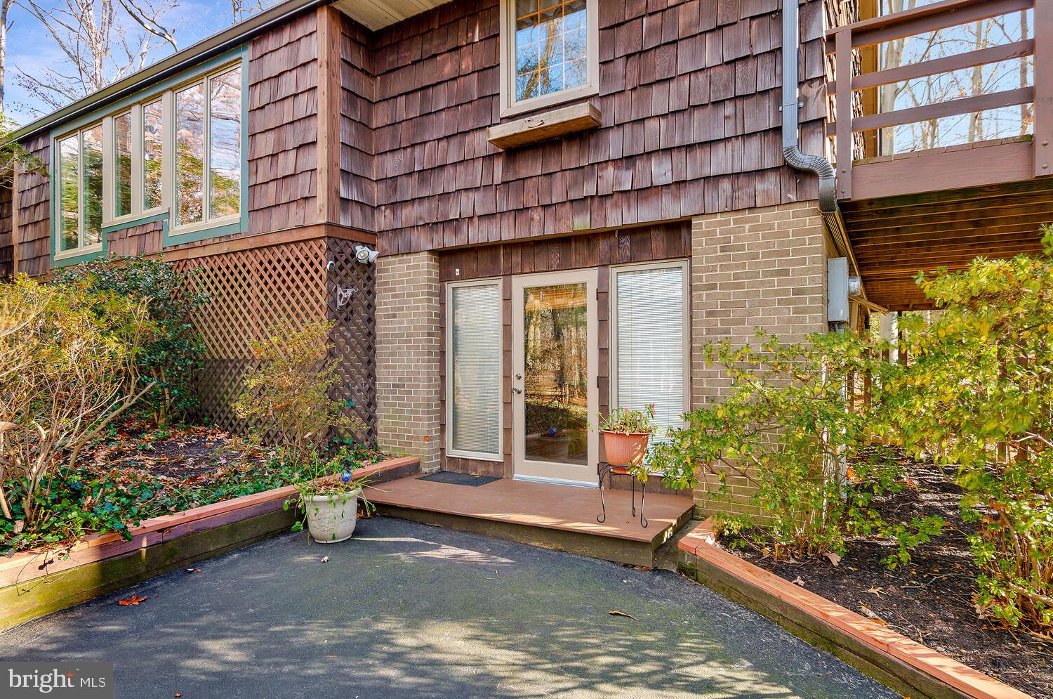 111 Autumn Court Huntingtown, MD 20639 - Photo 3 of 48 a view of a building with a large window and potted plants