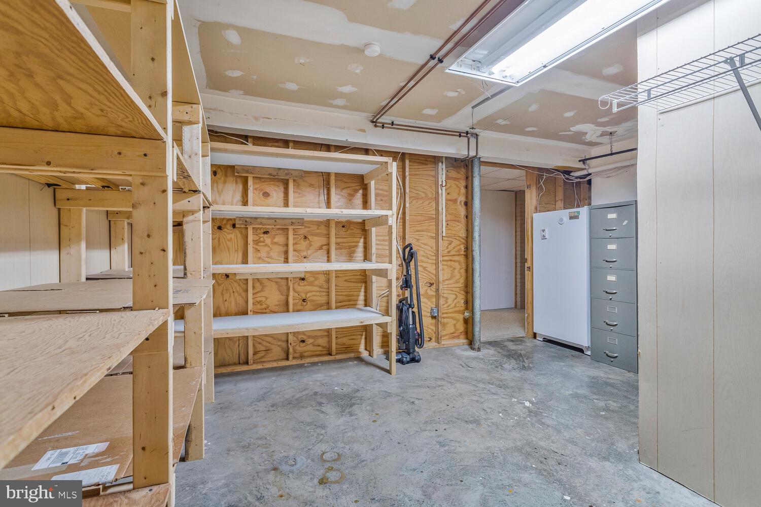 111 Autumn Court Huntingtown, MD 20639 - Photo 35 of 48 a view of an empty room with a fireplace