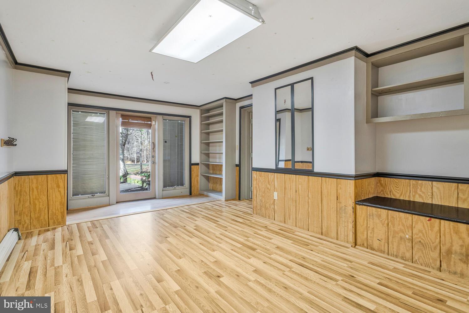 111 Autumn Court Huntingtown, MD 20639 - Photo 4 of 48 a view of an empty room with wooden floor and a window