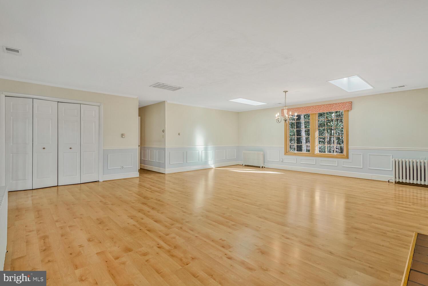 111 Autumn Court Huntingtown, MD 20639 - Photo 6 of 48 wooden floor in an empty room with a window