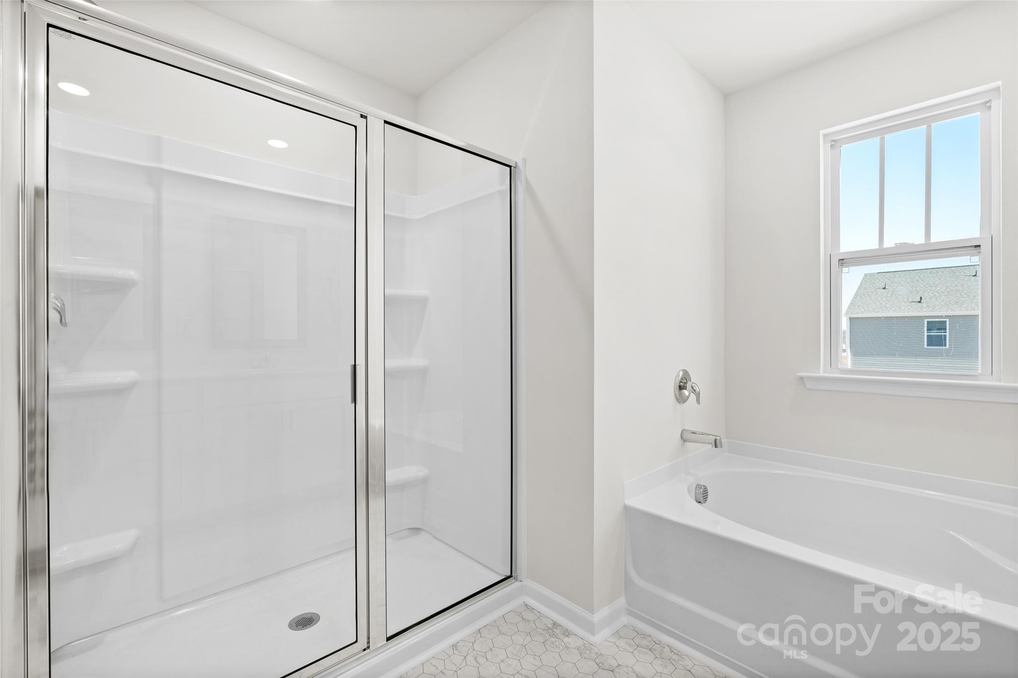 97 Salers Road Fletcher, NC 28732 - Photo 18 of 28 a bathroom with a bathtub and a shower