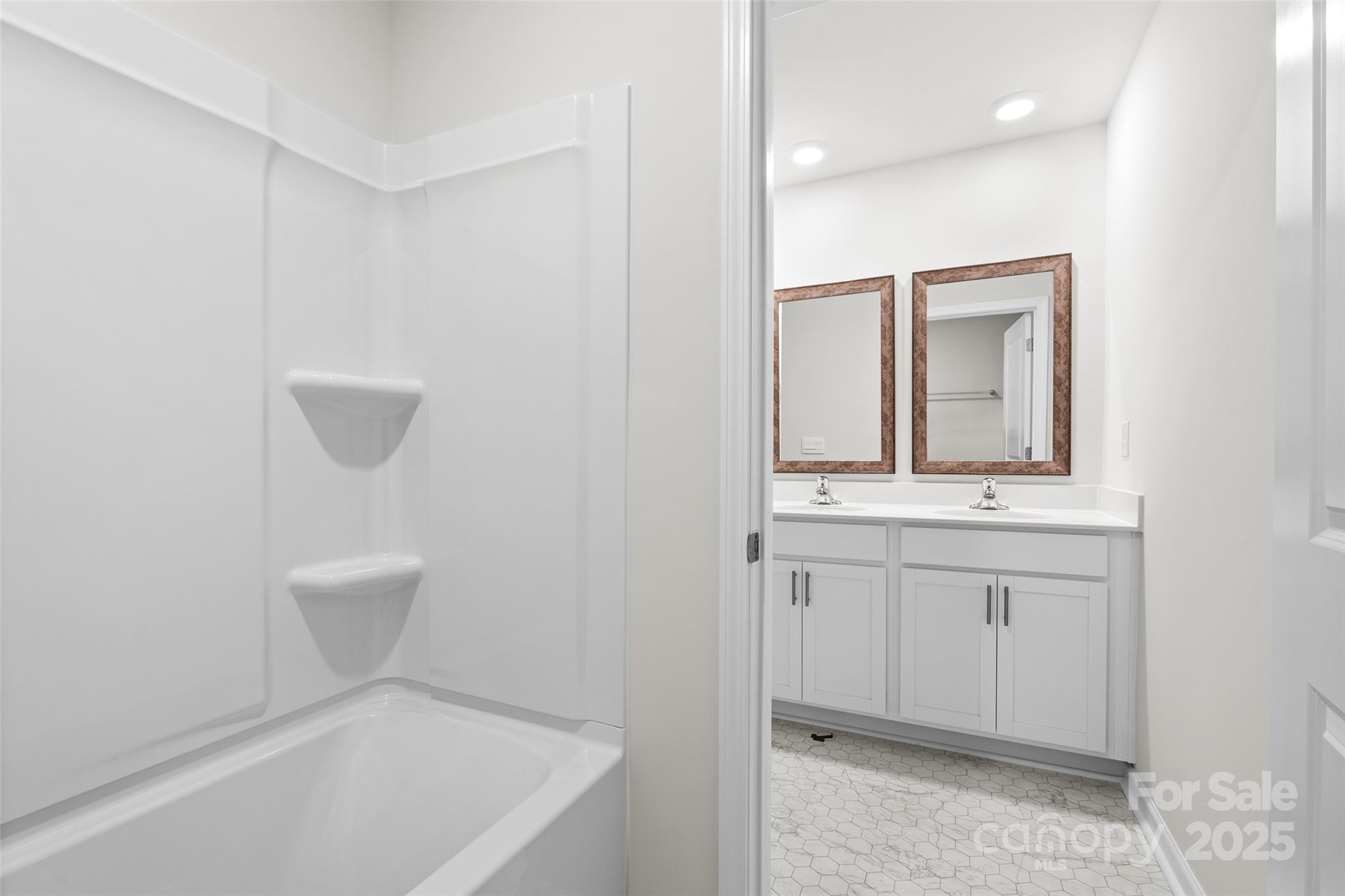 97 Salers Road Fletcher, NC 28732 - Photo 20 of 28 a bathroom with a sink a toilet and mirror