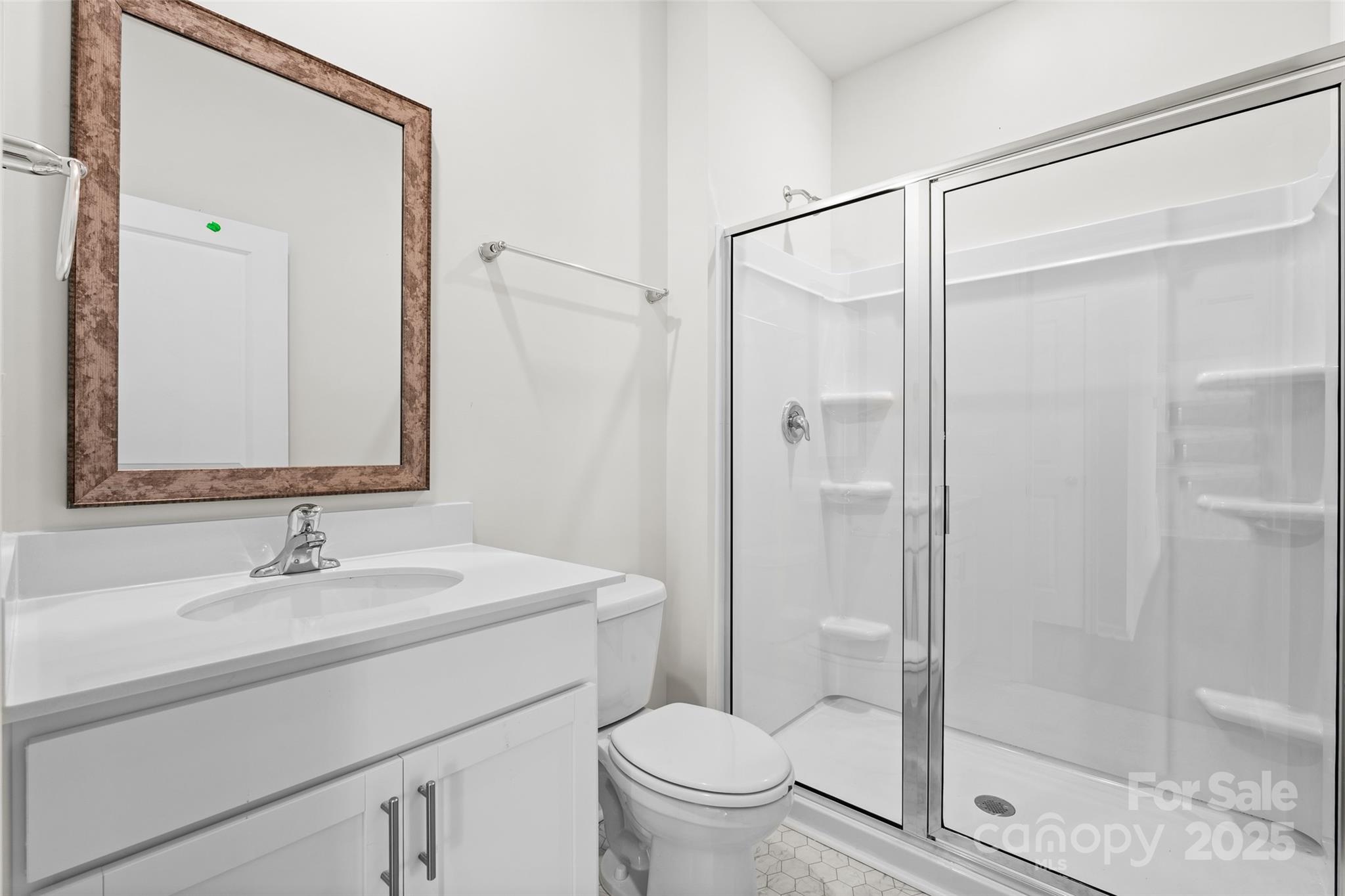 97 Salers Road Fletcher, NC 28732 - Photo 21 of 28 a bathroom with a sink toilet and shower