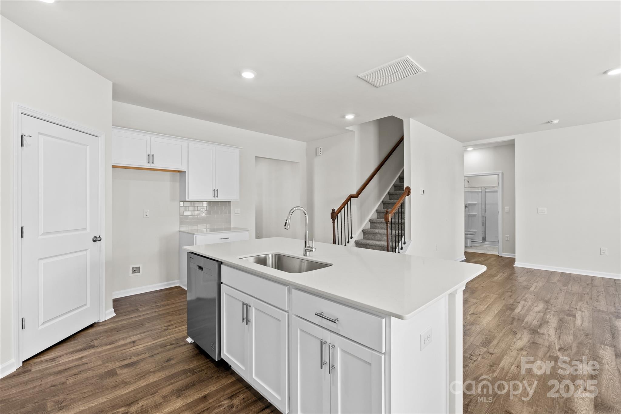 97 Salers Road Fletcher, NC 28732 - Photo 6 of 28 a kitchen with a sink and wooden floor
