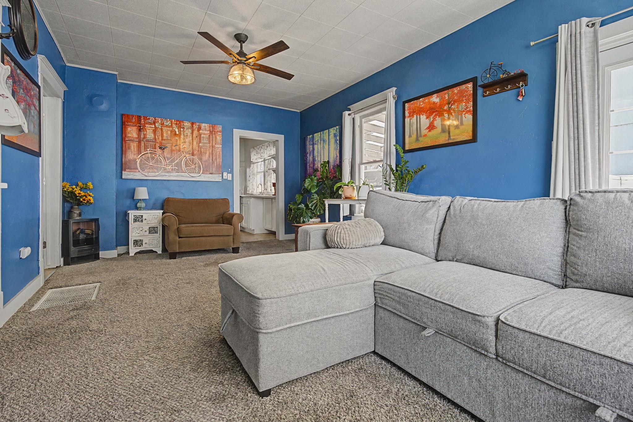 216 4th Street Clifton, CO 81520 - Photo 5 of 17 a living room with furniture and a flat screen tv