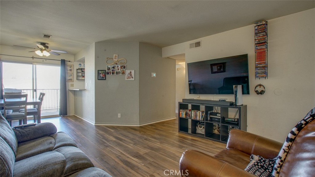 7641 Reseda Boulevard, Unit 128Z Reseda, CA 91335 - Photo 4 of 44 a living room with furniture and a flat screen tv