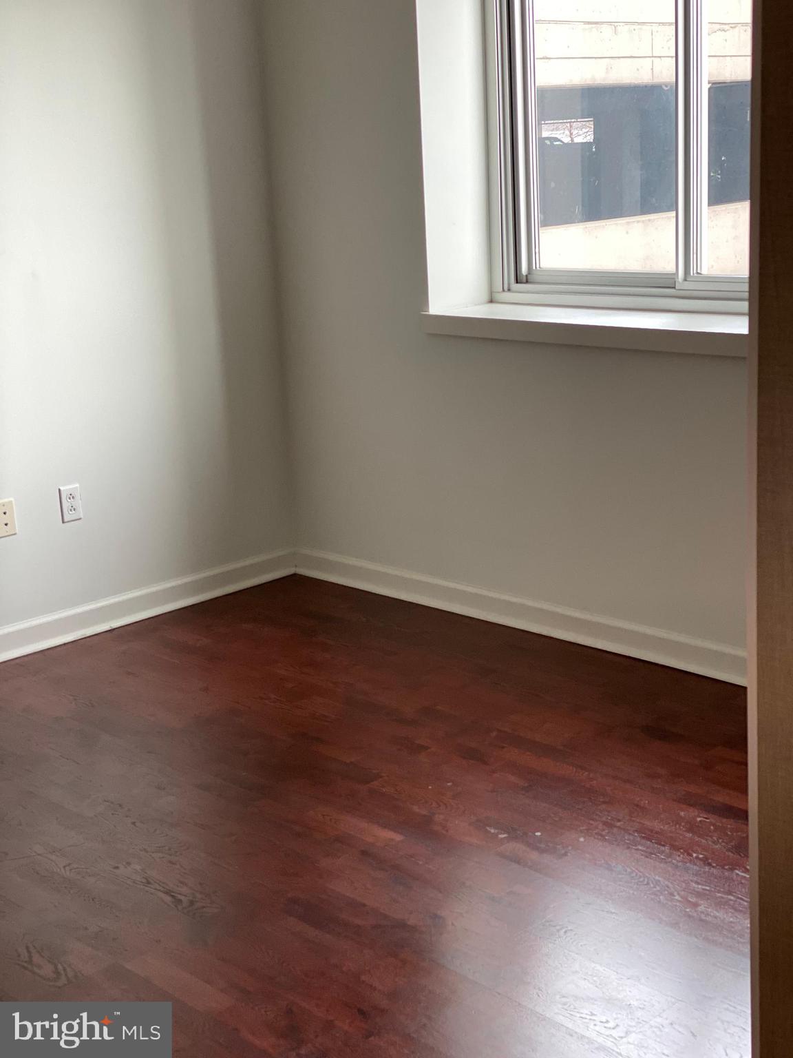 901 North Penn Street, Unit F207 Philadelphia, PA 19123 - Photo 5 of 12 an empty room with a window