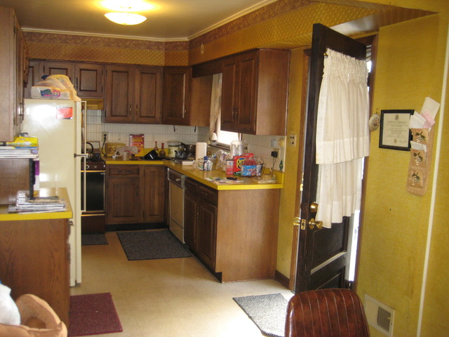 325 High Ridge Road Hillside, IL 60162 - Photo 3 of 17 a kitchen with a sink a refrigerator and cabinets