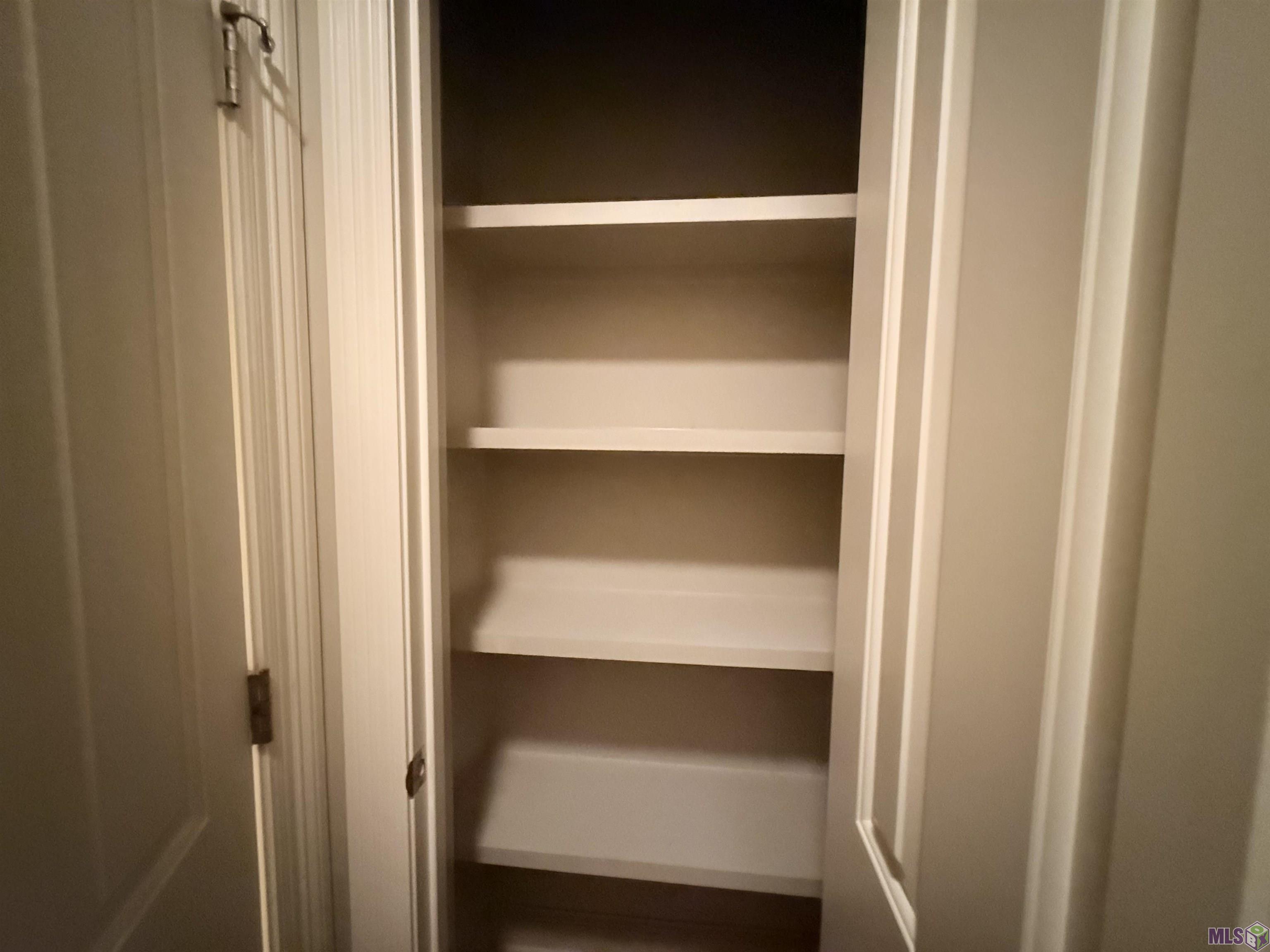 14013 Stone Gate Drive Baton Rouge, LA 70816 - Photo 6 of 13 Linen CLoset in Primary bathroom