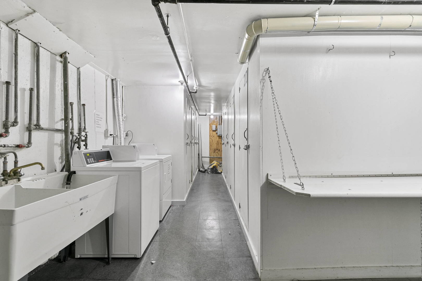 1130 Dunlop Avenue, Unit 2C Forest Park, IL 60130 - Photo 11 of 15 a view of a bathroom with a sink and mirror