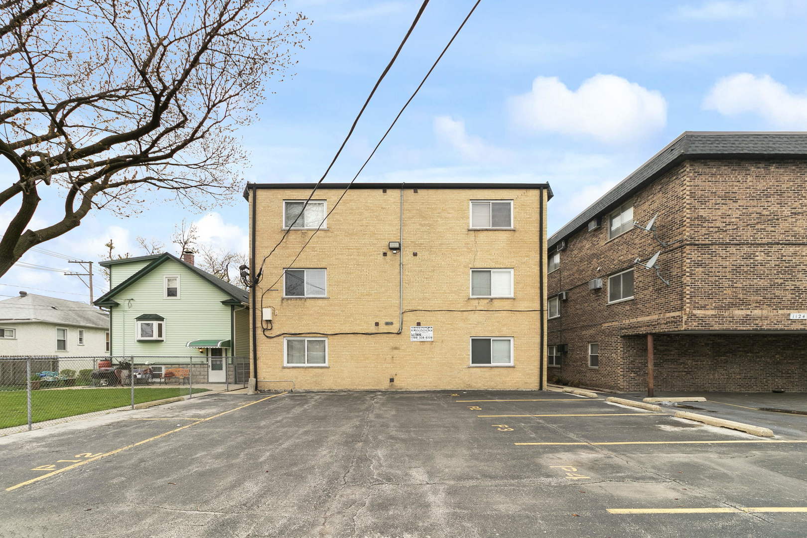 1130 Dunlop Avenue, Unit 2C Forest Park, IL 60130 - Photo 13 of 15 a view of a house with a yard