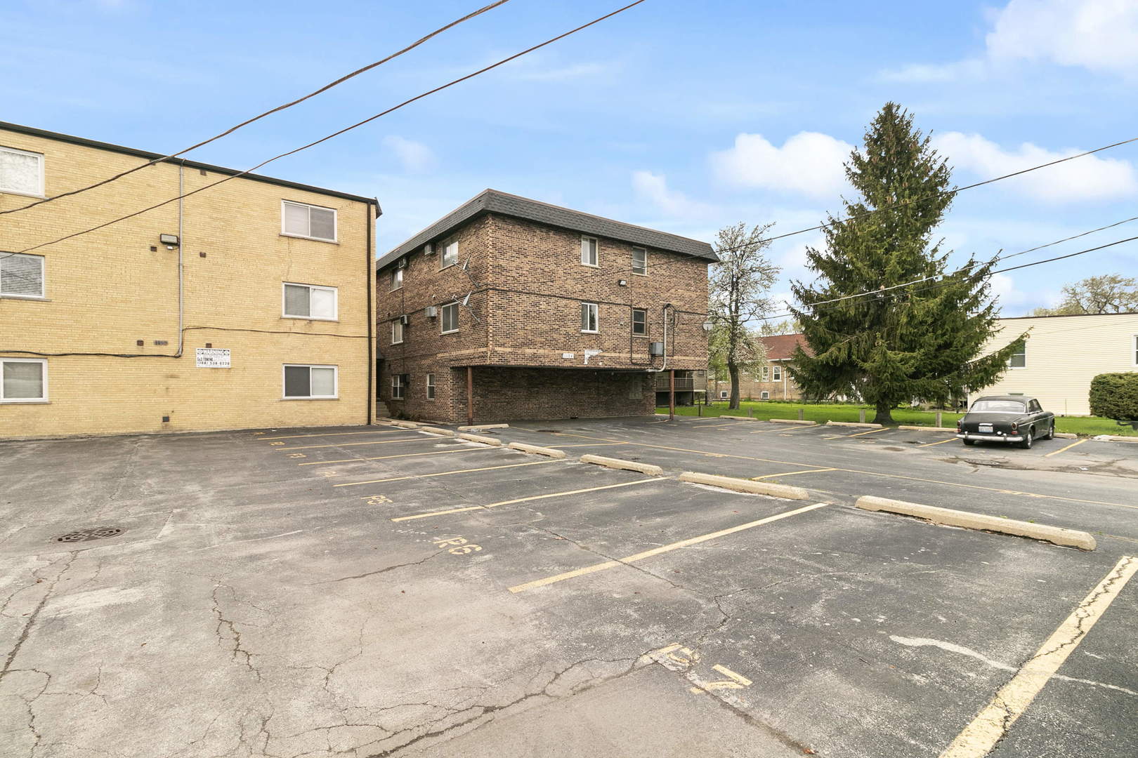 1130 Dunlop Avenue, Unit 2C Forest Park, IL 60130 - Photo 14 of 15 a front view of a house with a yard and garage