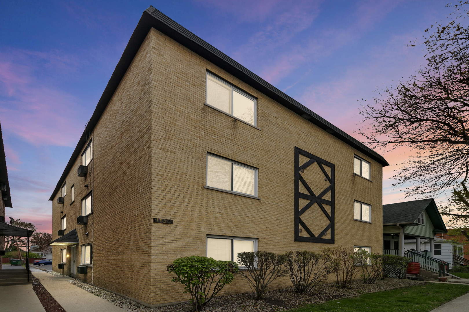 1130 Dunlop Avenue, Unit 2C Forest Park, IL 60130 - Photo 15 of 15 a front view of a house with garden