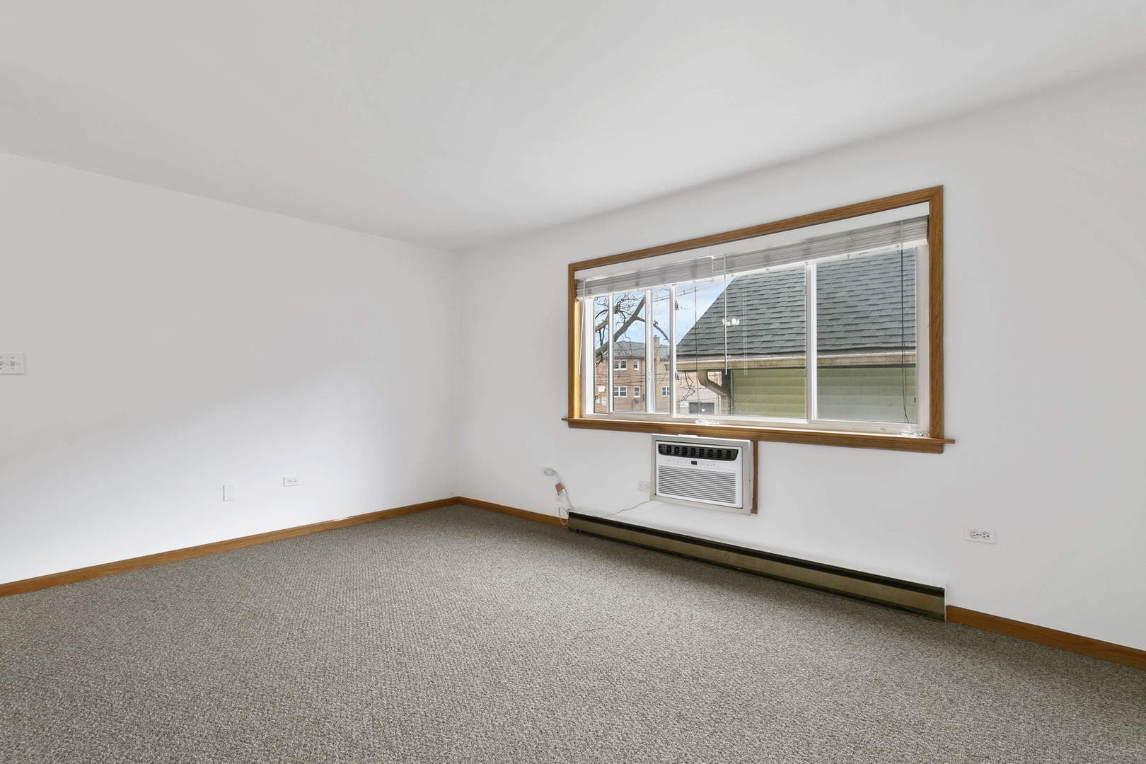 1130 Dunlop Avenue, Unit 2C Forest Park, IL 60130 - Photo 3 of 15 an empty room with window
