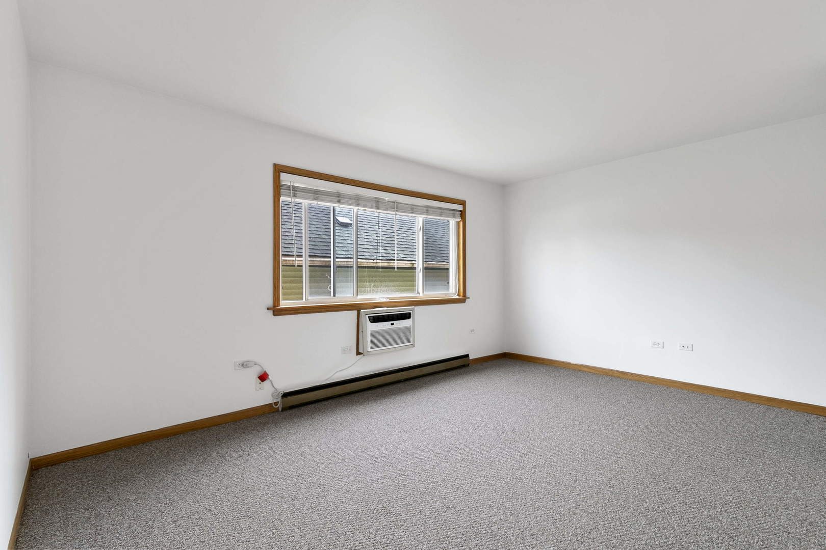 1130 Dunlop Avenue, Unit 2C Forest Park, IL 60130 - Photo 4 of 15 an empty room with a window