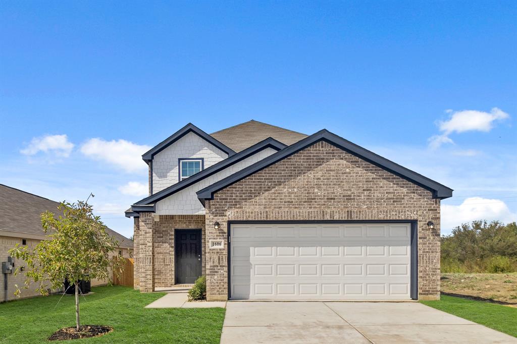 1606 Romans Road Ennis, TX 75119 - Photo 1 of 16 a view of a house with a yard and potted plants