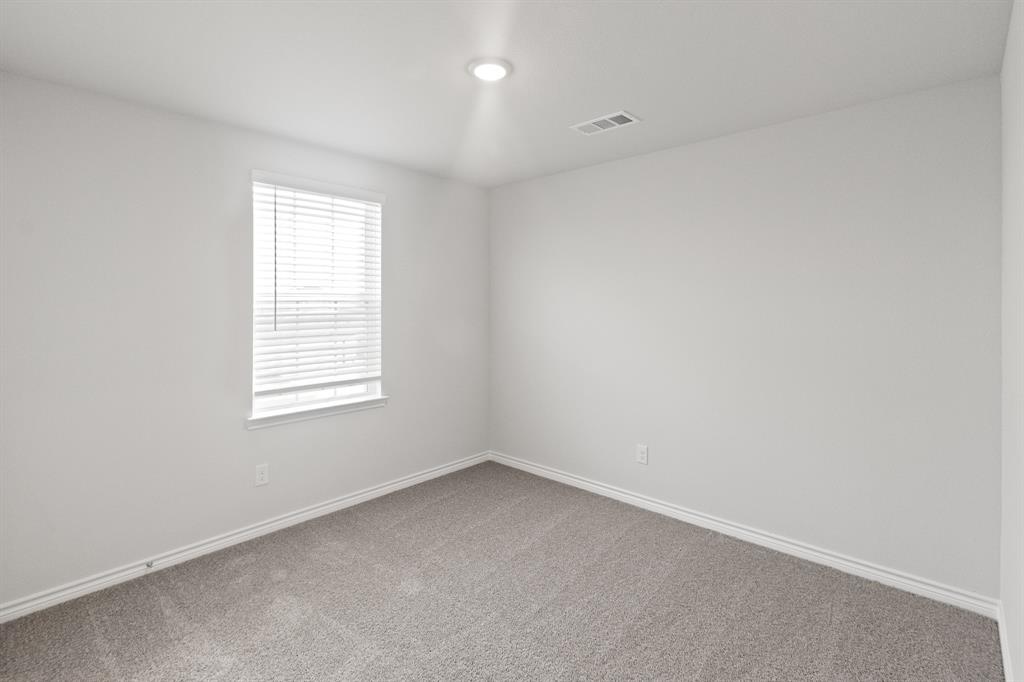 1606 Romans Road Ennis, TX 75119 - Photo 13 of 16 an empty room with a window