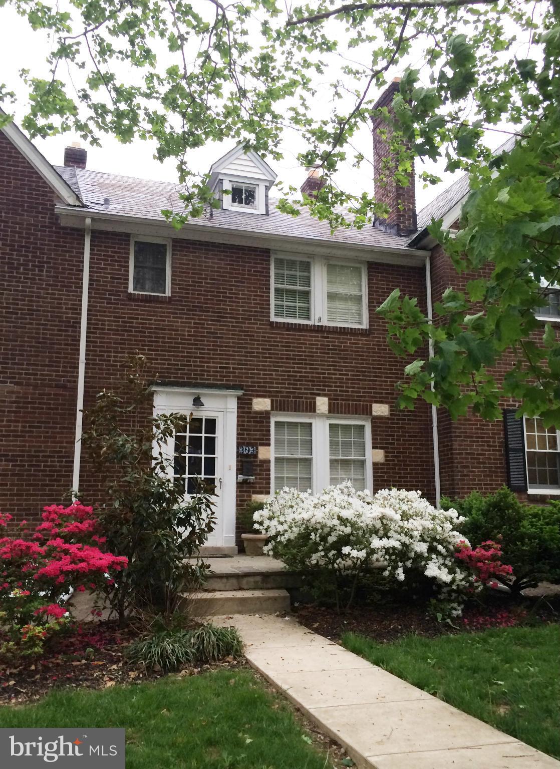 303 Murdock Road Baltimore, MD 21212 - Photo 1 of 25 a front view of a house with a garden