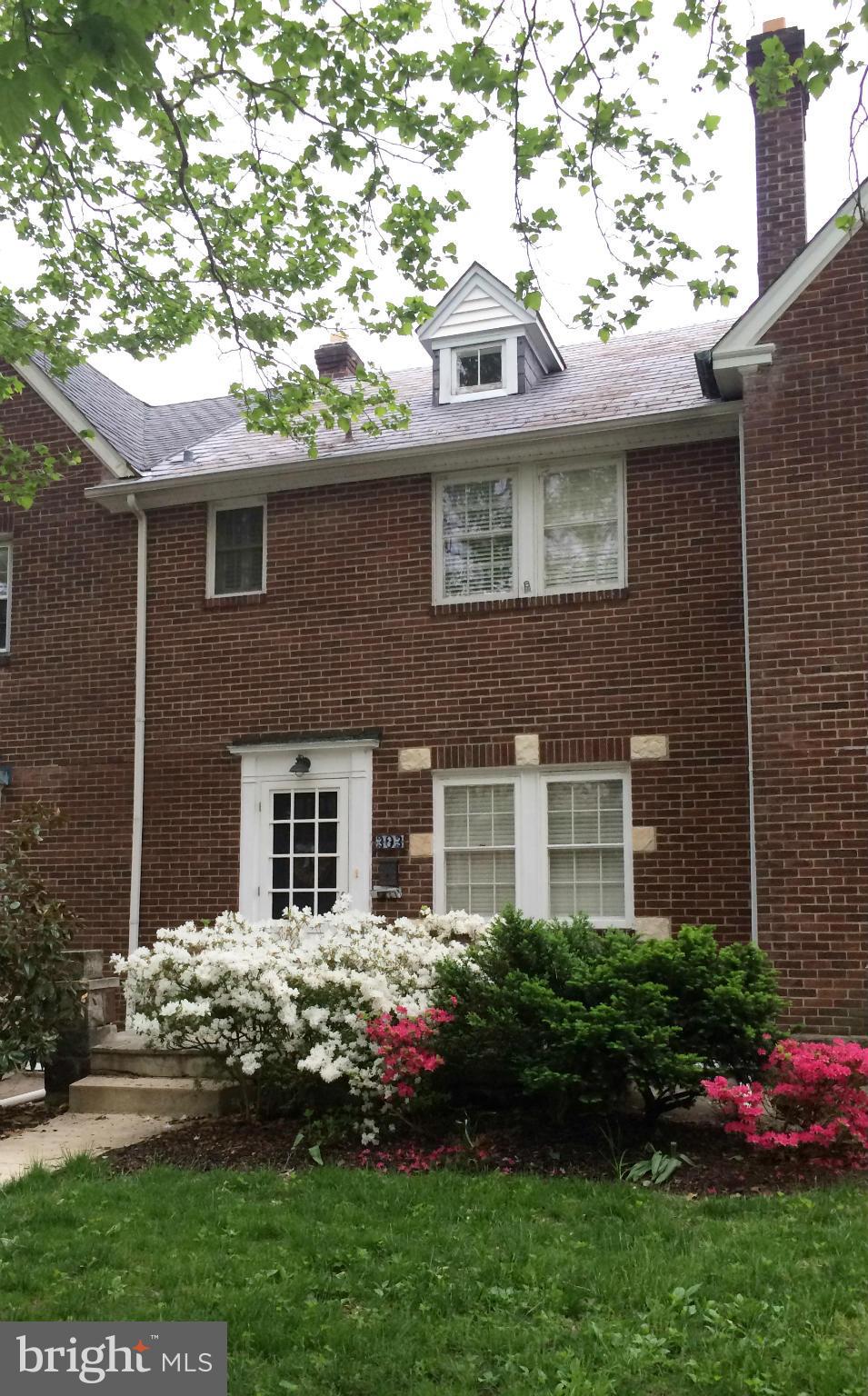 303 Murdock Road Baltimore, MD 21212 - Photo 2 of 25 a front view of a house with a garden