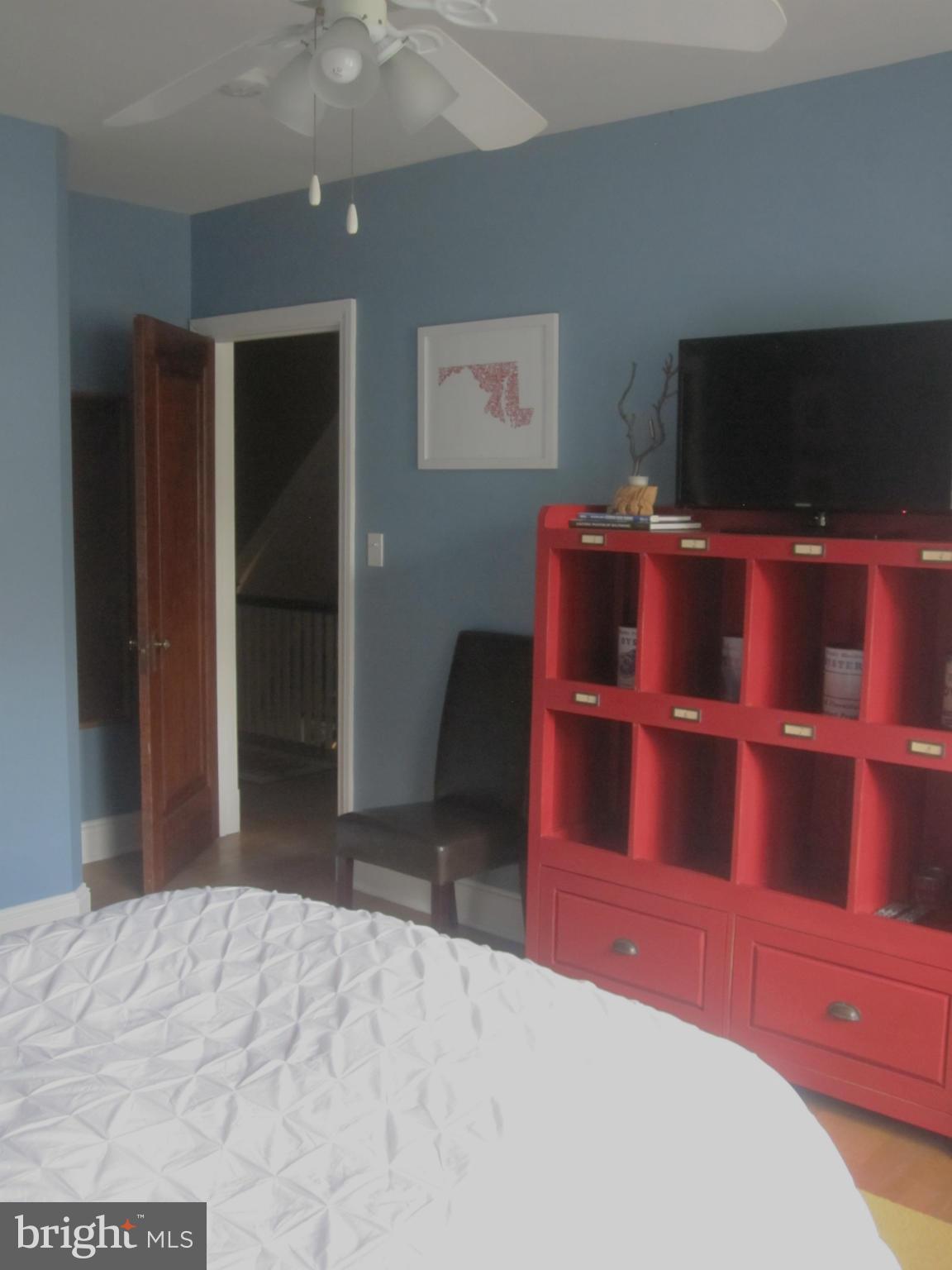 303 Murdock Road Baltimore, MD 21212 - Photo 11 of 25 a bedroom with a bed and a flat screen tv