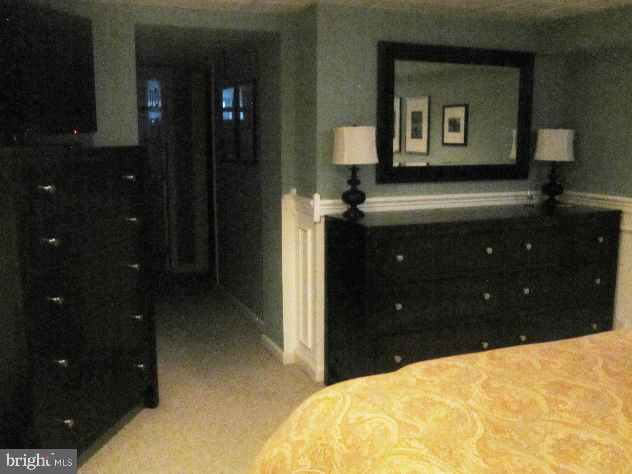 303 Murdock Road Baltimore, MD 21212 - Photo 19 of 25 a bedroom with a bed and a night stand
