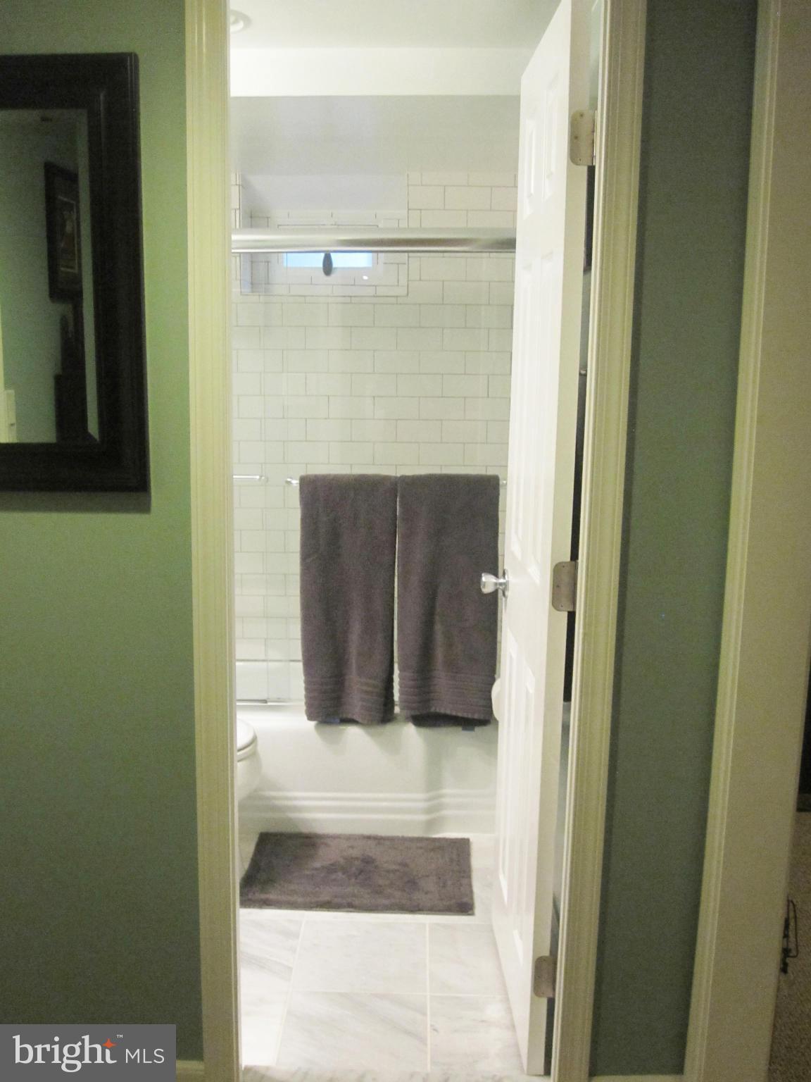 303 Murdock Road Baltimore, MD 21212 - Photo 20 of 25 a bathroom with a sink and a mirror