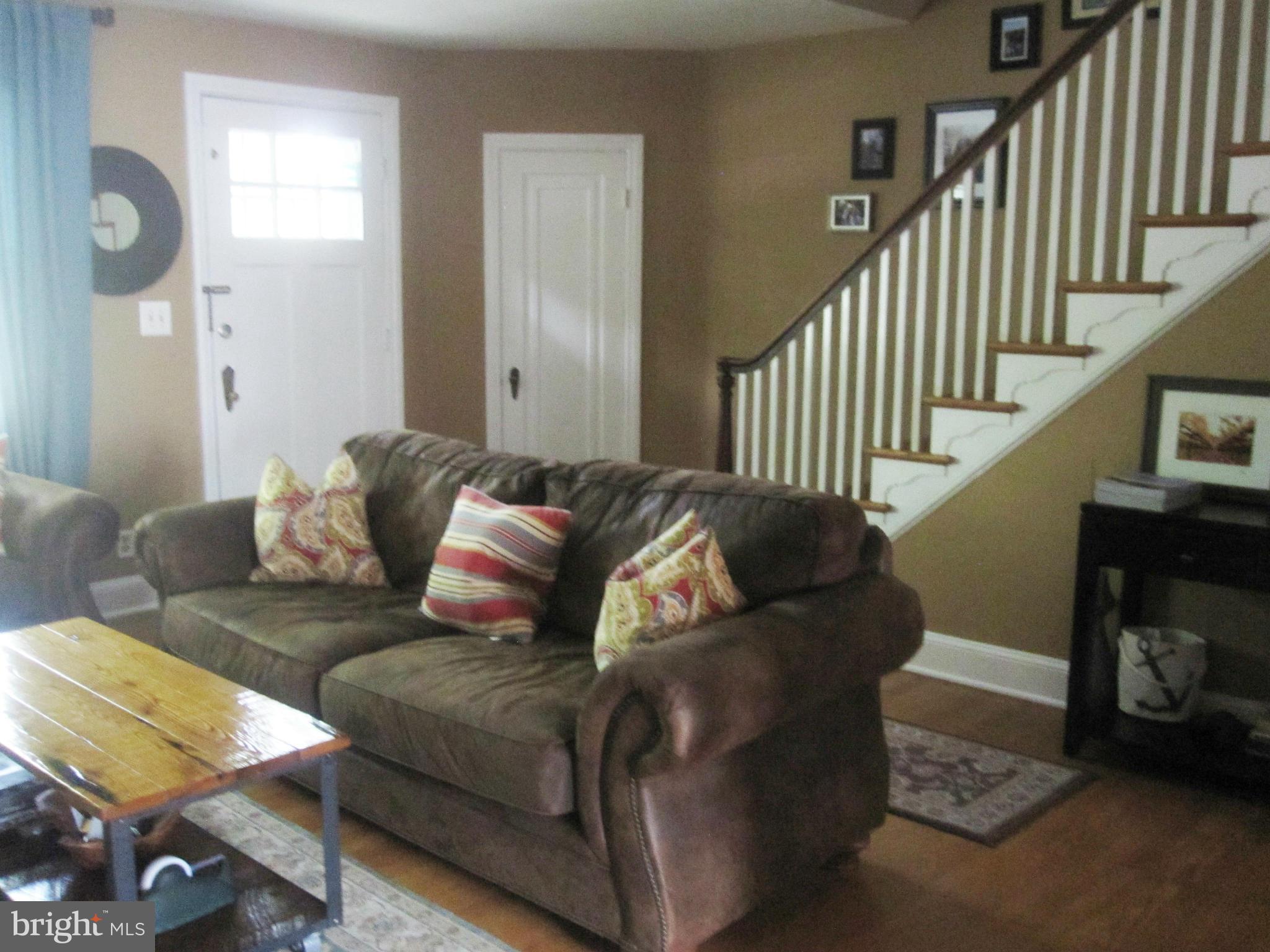 303 Murdock Road Baltimore, MD 21212 - Photo 3 of 25 a living room with furniture and a wooden floor