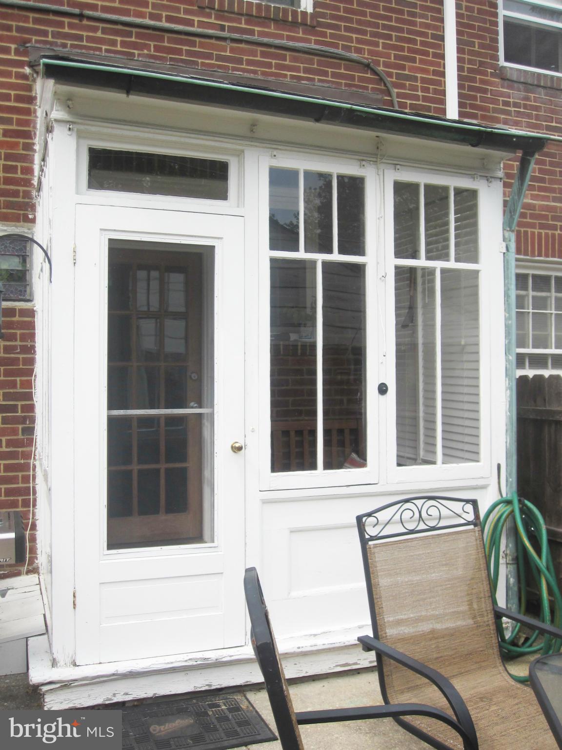 303 Murdock Road Baltimore, MD 21212 - Photo 22 of 25 a view of a chair and table in front of a house