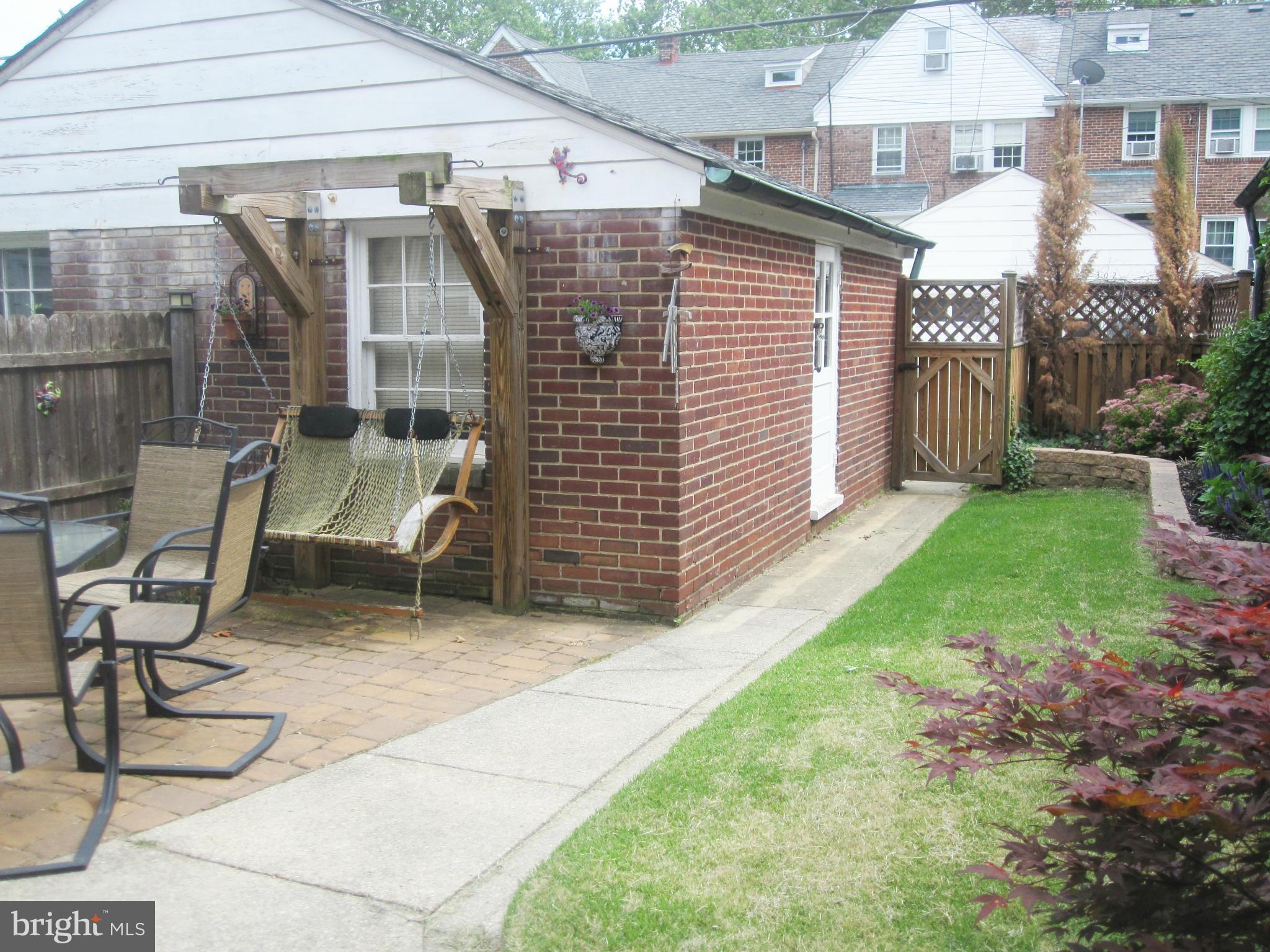 303 Murdock Road Baltimore, MD 21212 - Photo 24 of 25 a view of a chair and table in backyard of the house