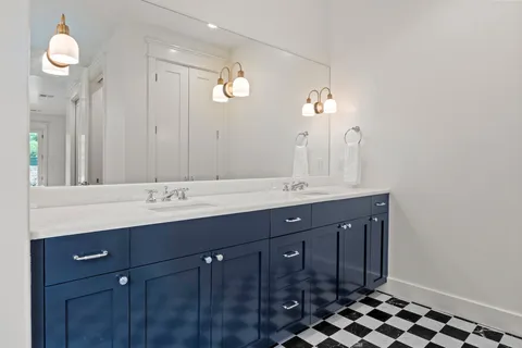 a bath room with a sink and a window