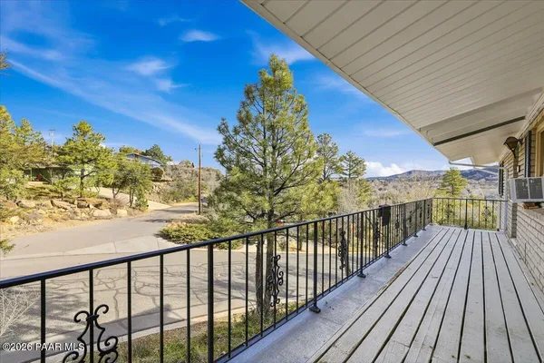 a view of balcony with wooden floor