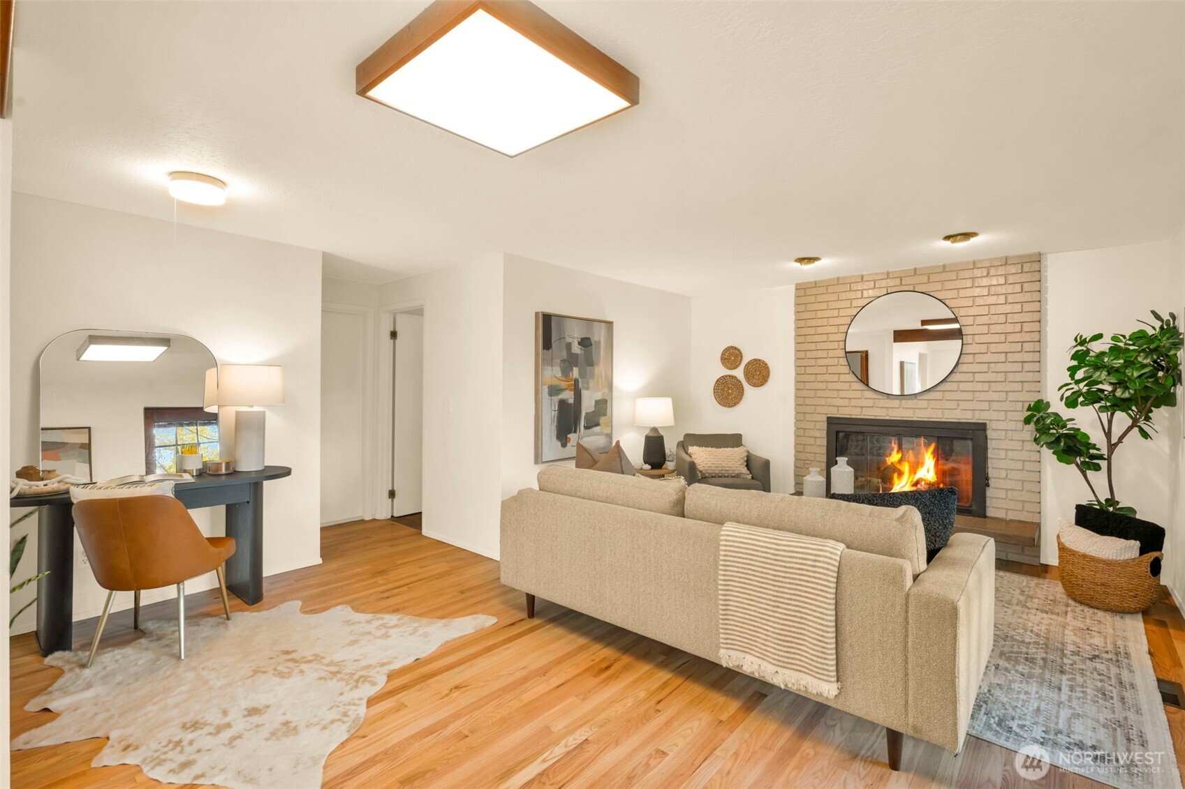4730 228th Street Southeast Bothell, WA 98021 - Photo 14 of 37 a living room with furniture a large window and a fireplace