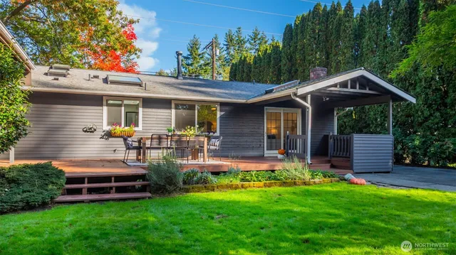 a bedroom with a large bed and a large window