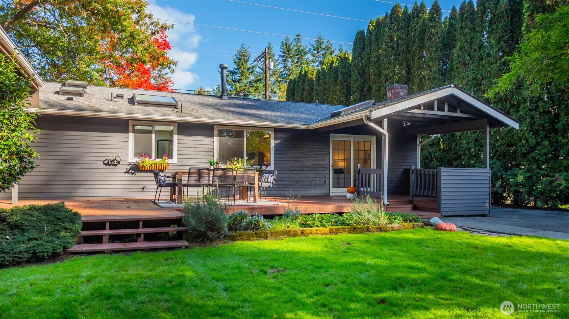 4730 228th Street Southeast Bothell, WA 98021 - Photo 20 of 37 a front view of house with a garden and patio