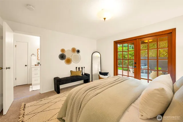 a bedroom with bed and a window