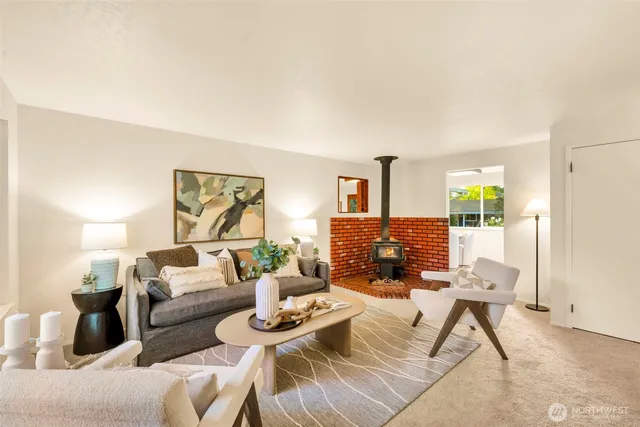 a living room with furniture a window and a table